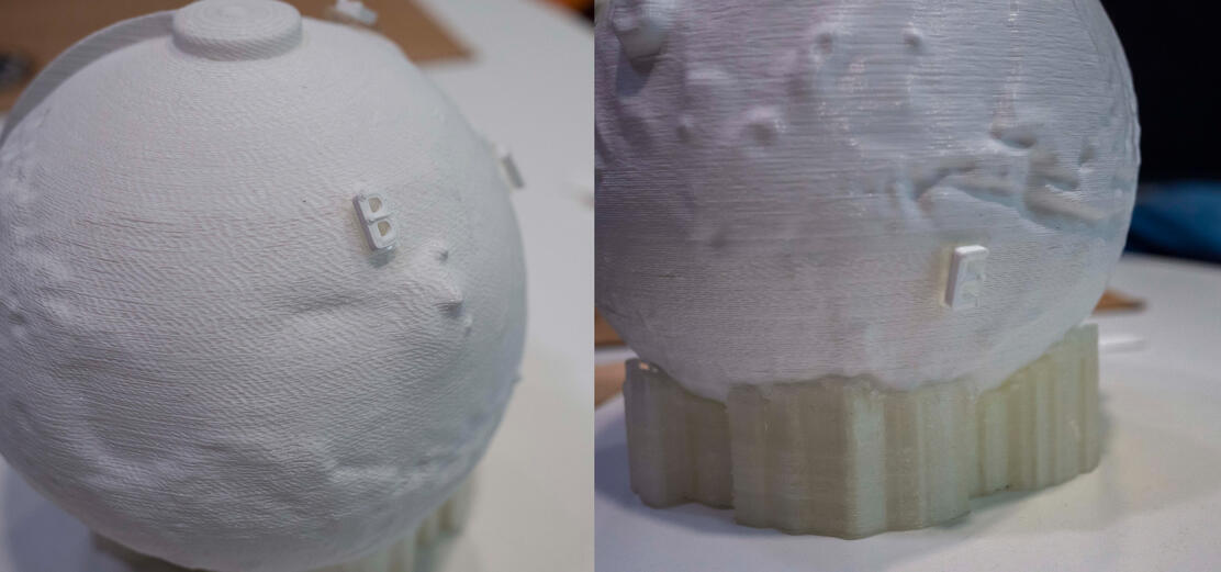 Detail of the braille tags on the 3d printed planet. They are used to mark notable features